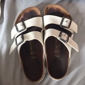 Used white Arizona Birkenstocks